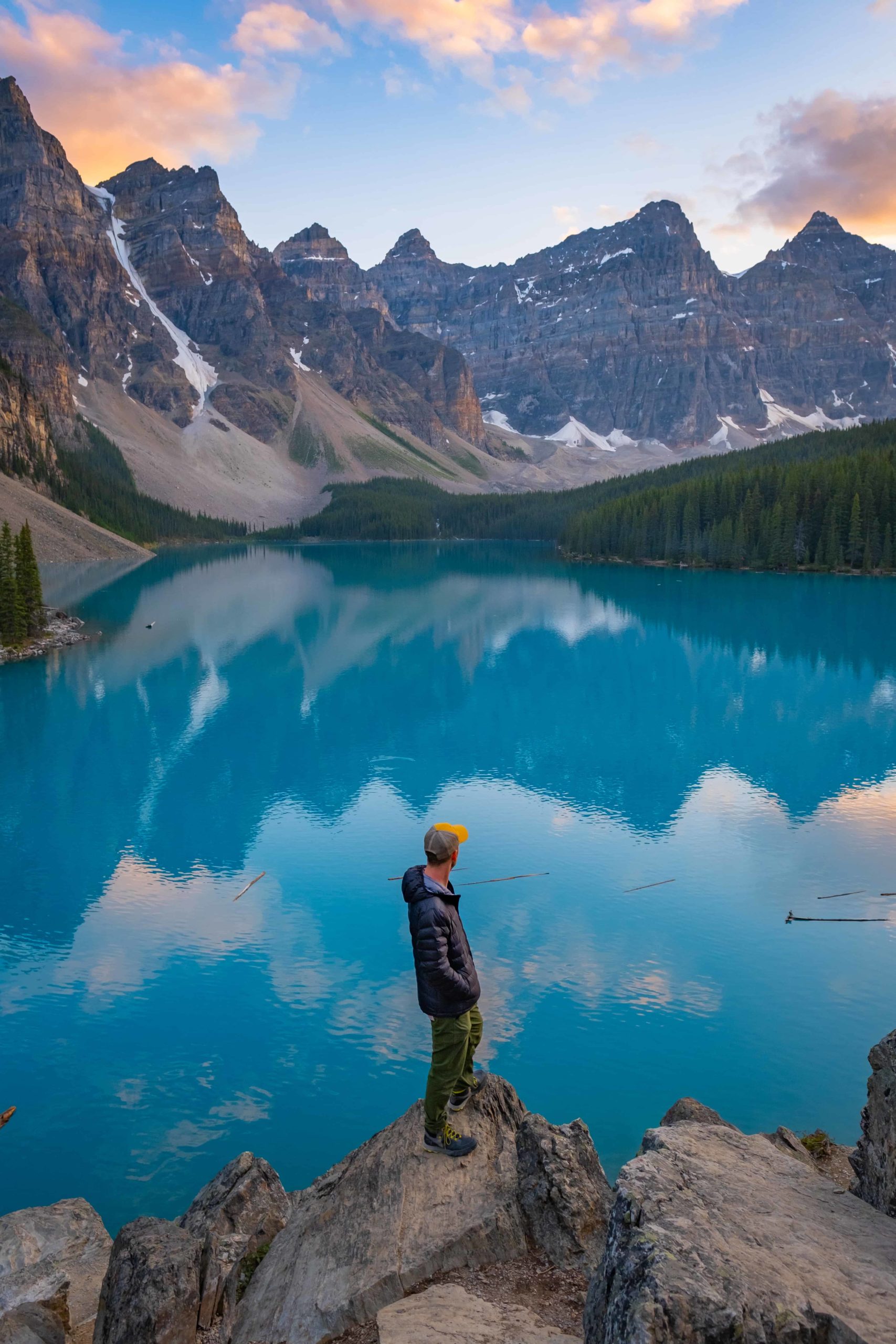 Cameron stands on Rock Pile at Moraine Lake