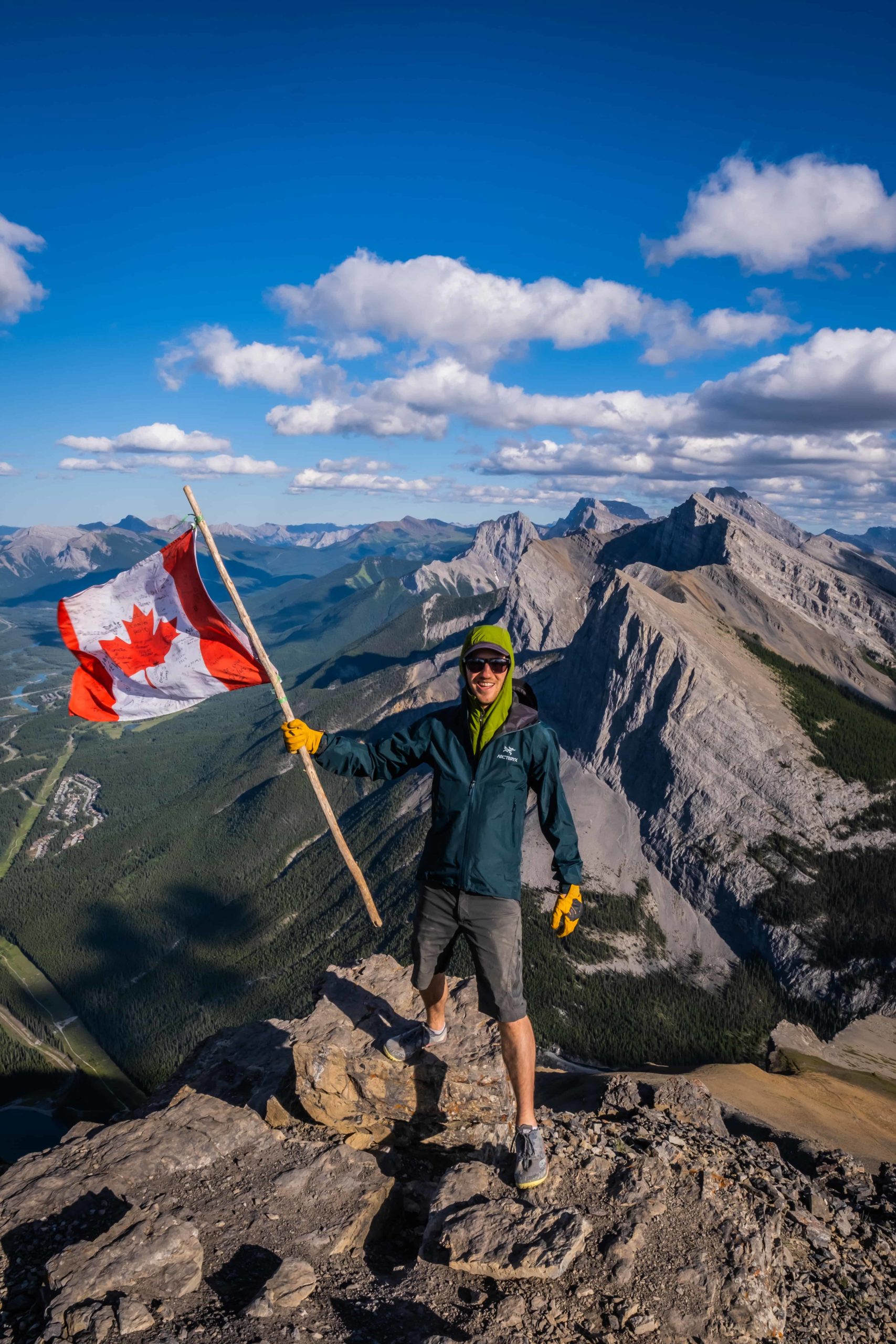 Cameron Holds The Canada Flag On The Summit Of EORR