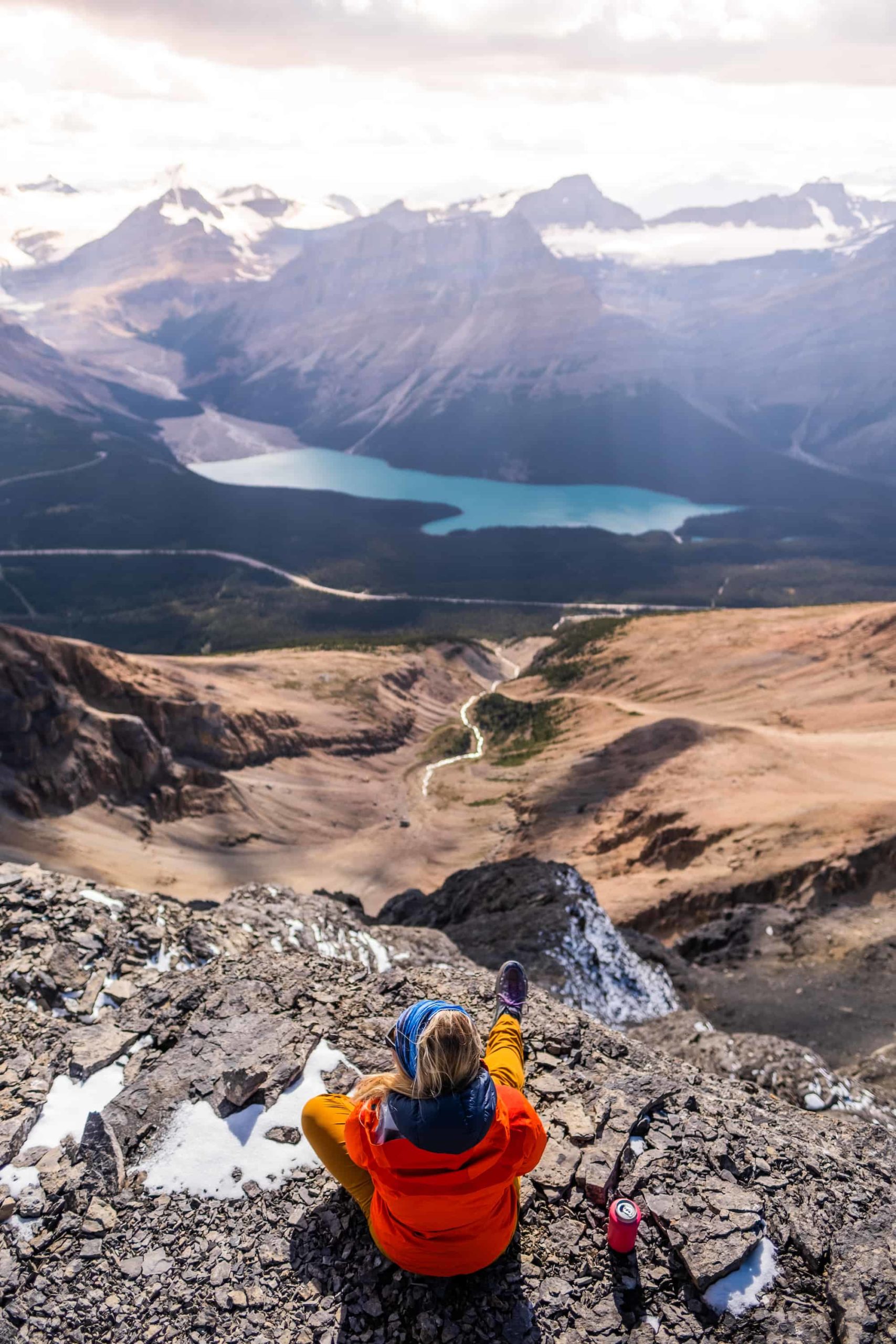 Enjoying my summit beer with amazing views over peyto lake from the summit of observation peak