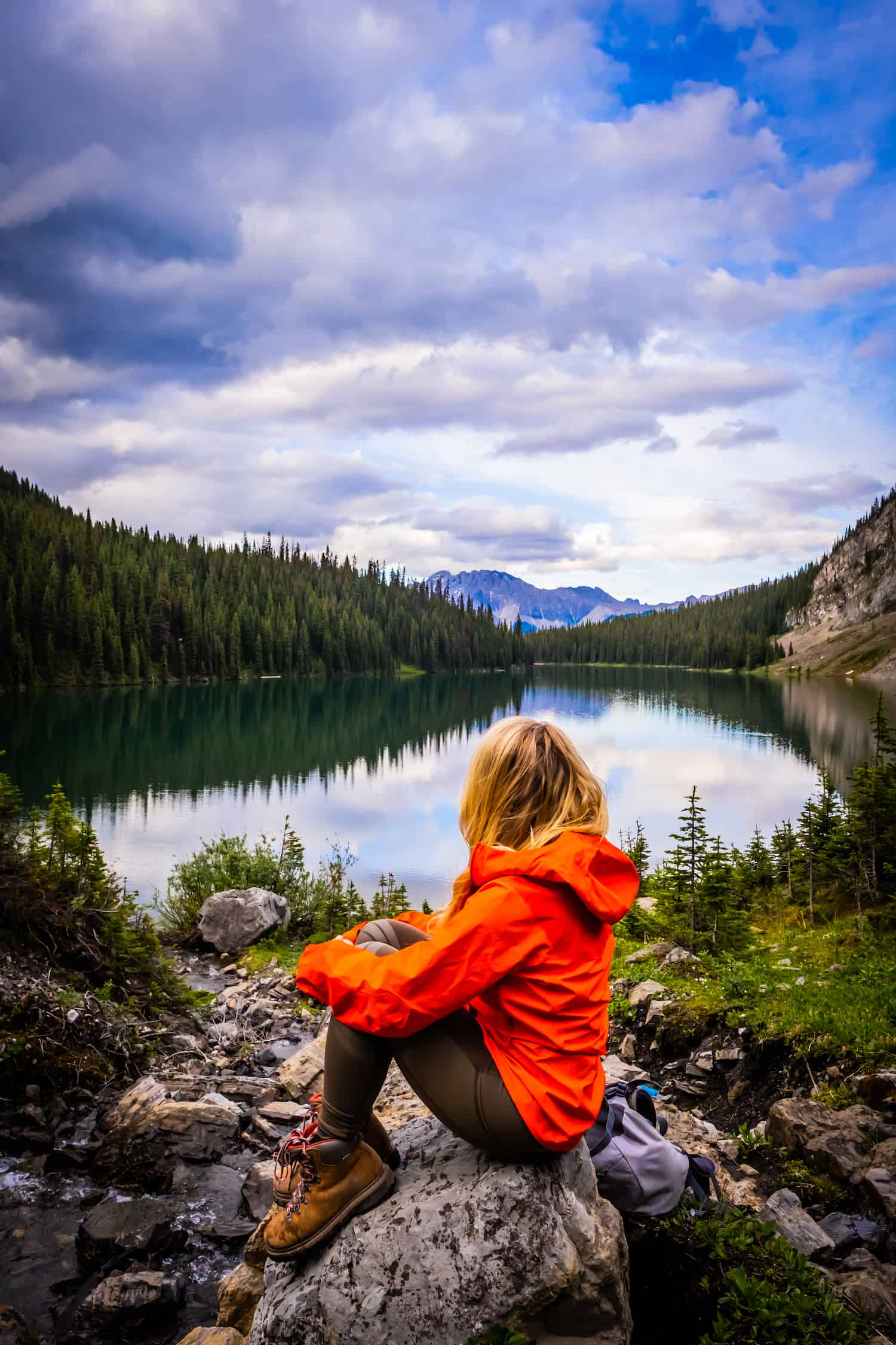 Natasha Sits Along Rawson Lake At Sunset