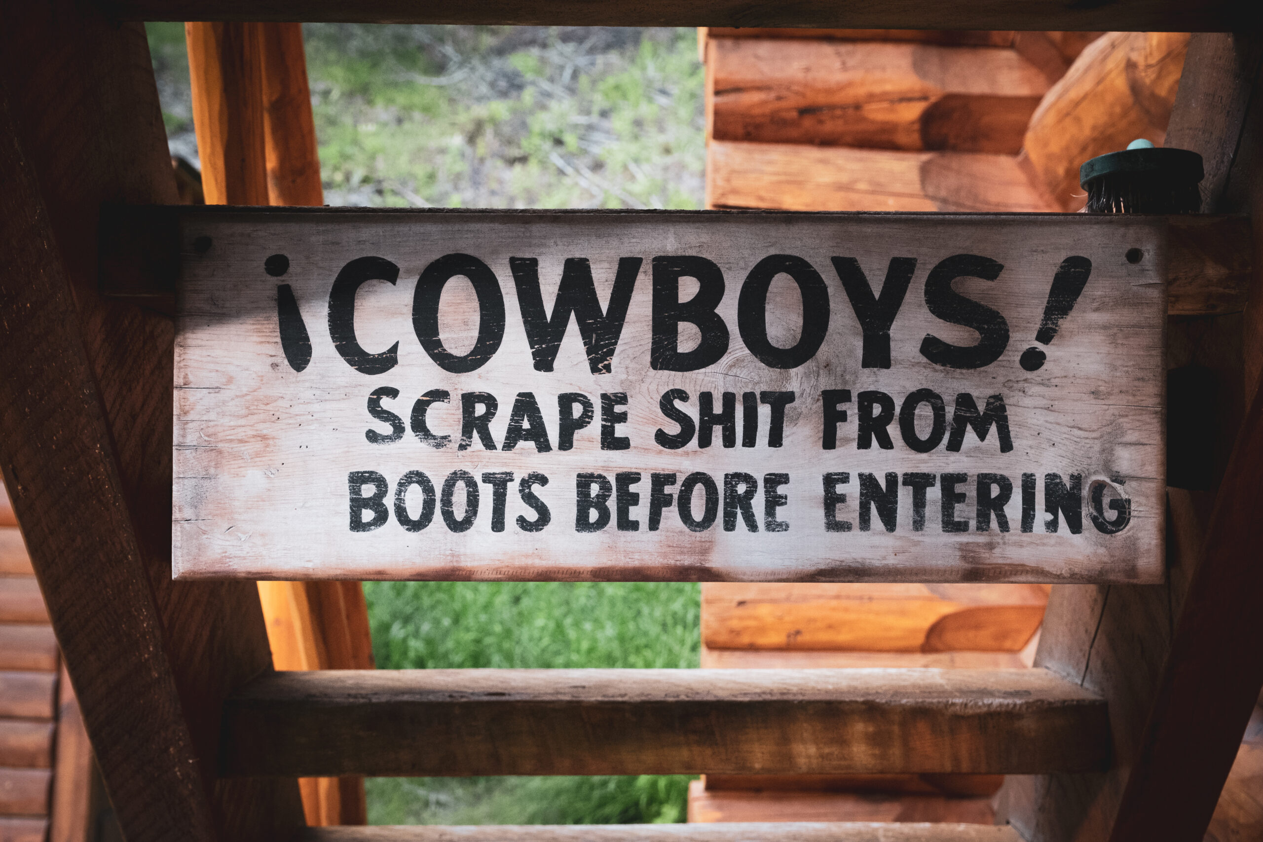 A Sign At Sundance Lodge "COWBOYS!, Scrape Shit From Boots Before Entering"