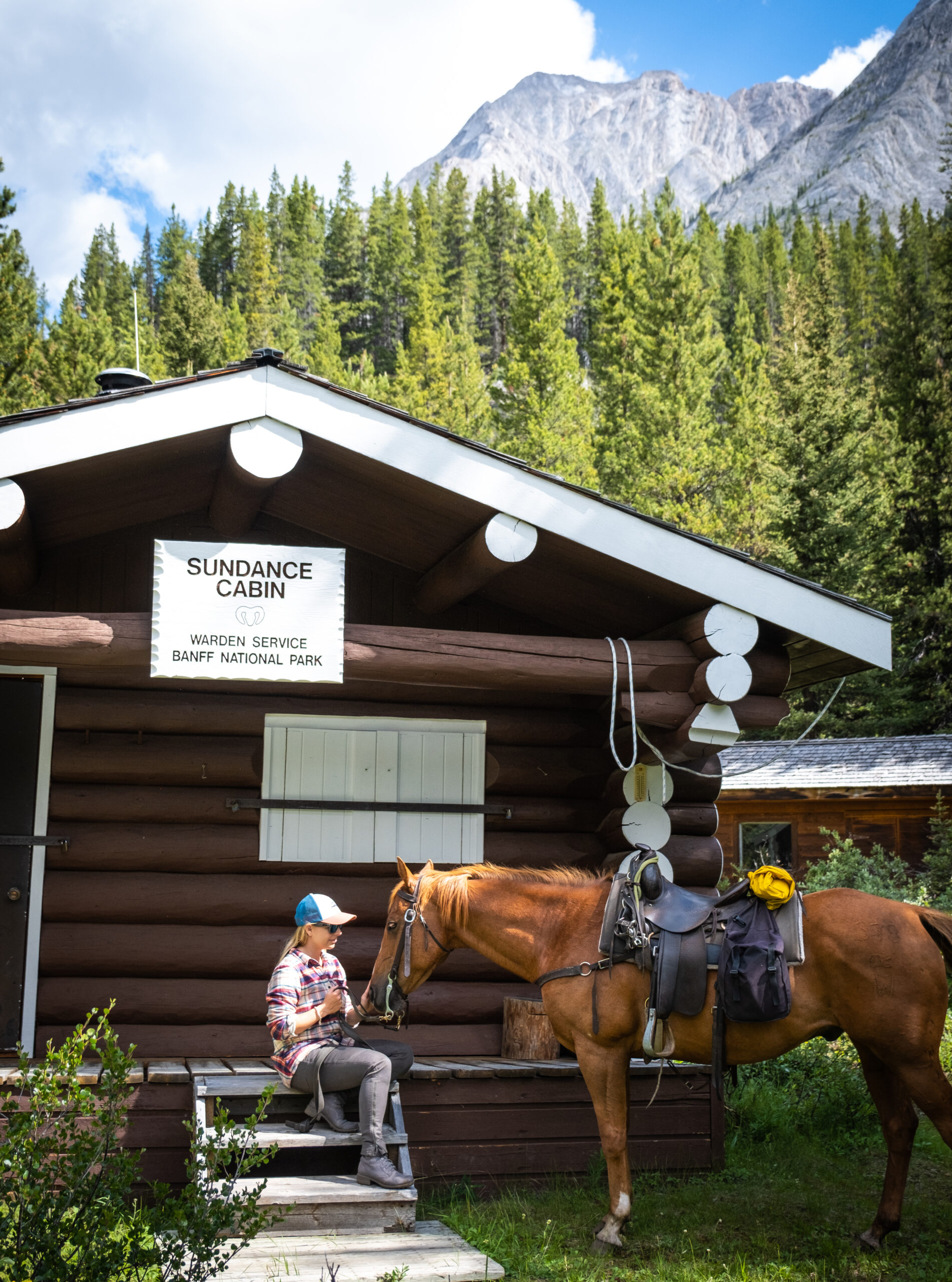 Natasha Sits Down With Her Horse At The Sundance Cabin