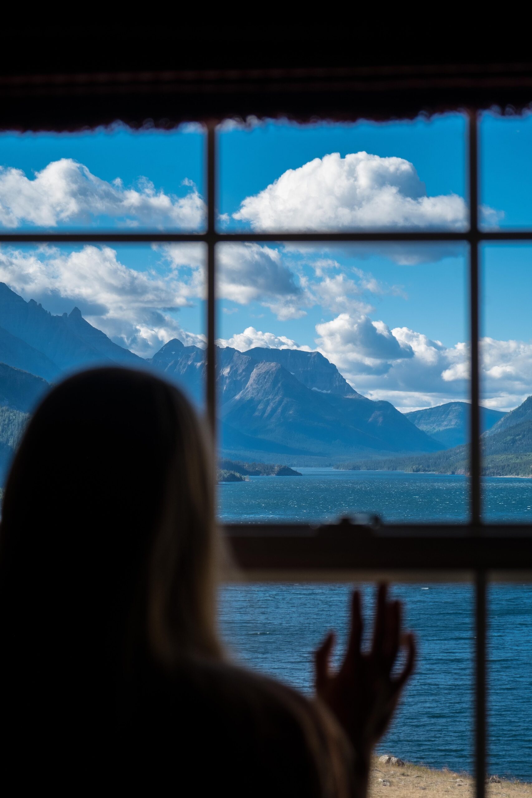 Natasha Looks Out Window of Prince Of Wales Hotel