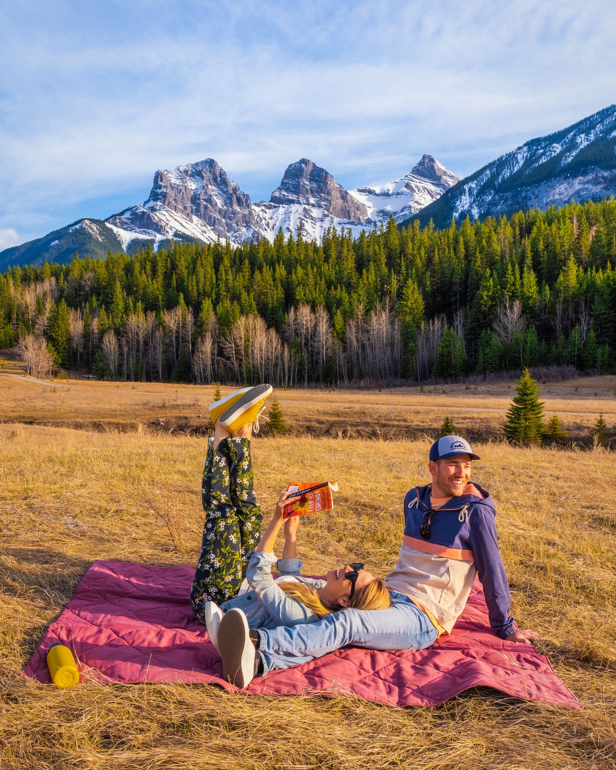 Cameron And Natasha Sit On Blanket In Three Sisters Neighborhood