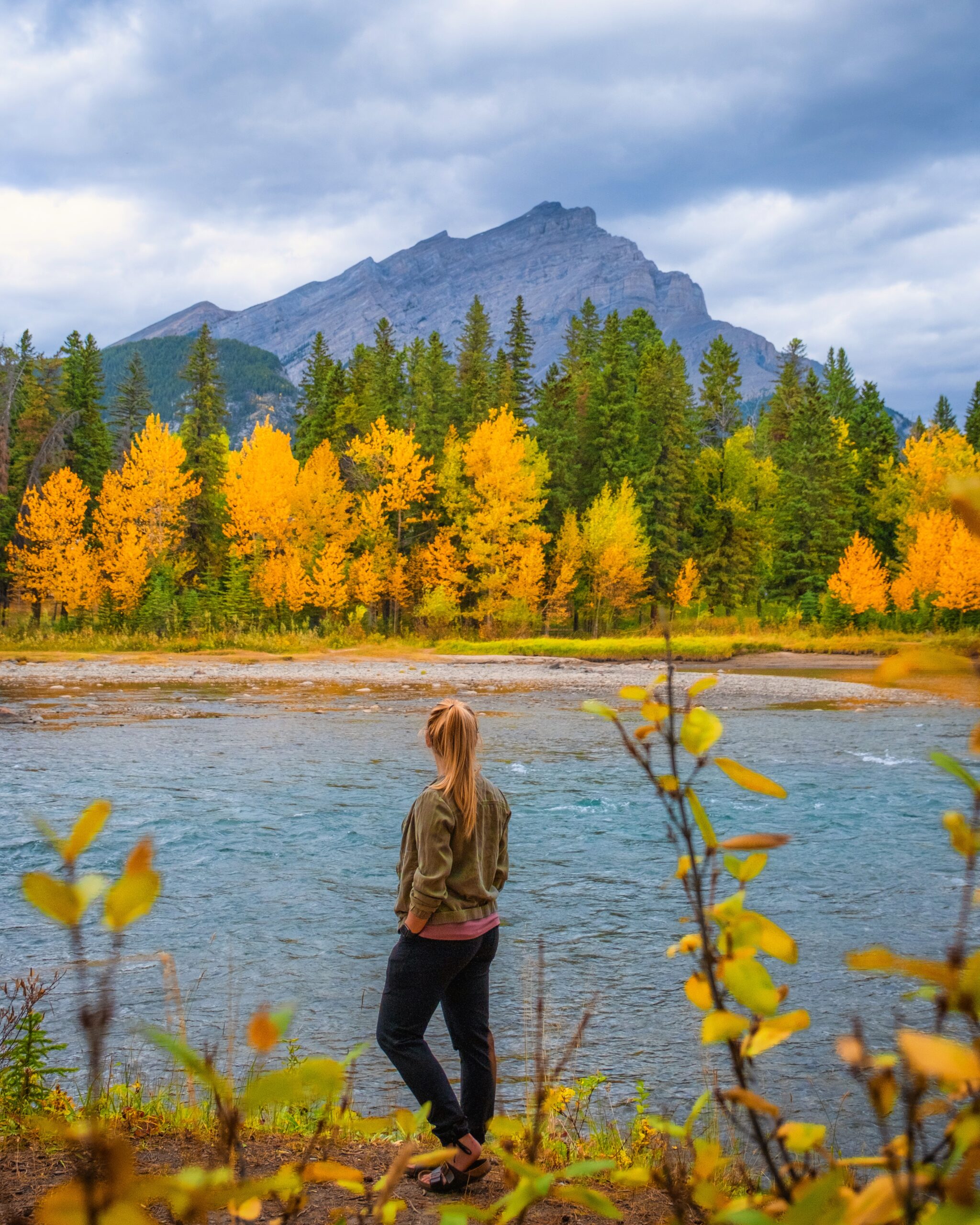 Natasha Stands Along The Bow River In September