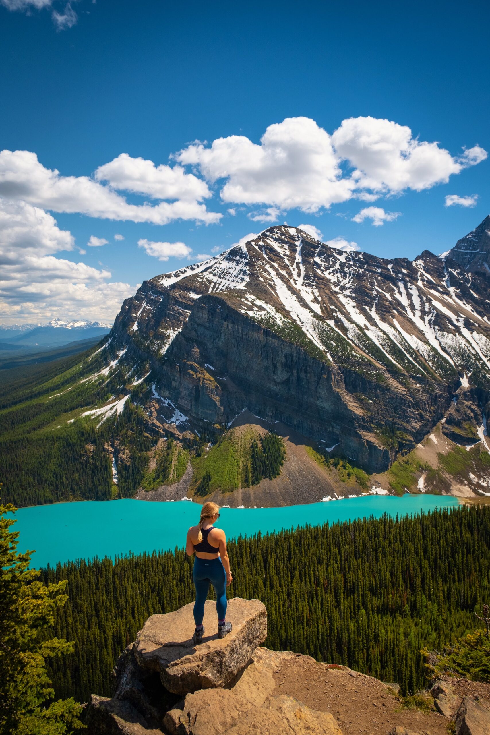 Natasha sitting above lake louise from the little beehive trail
