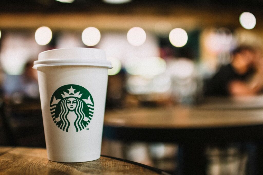 Starbucks coffee cup siting on table