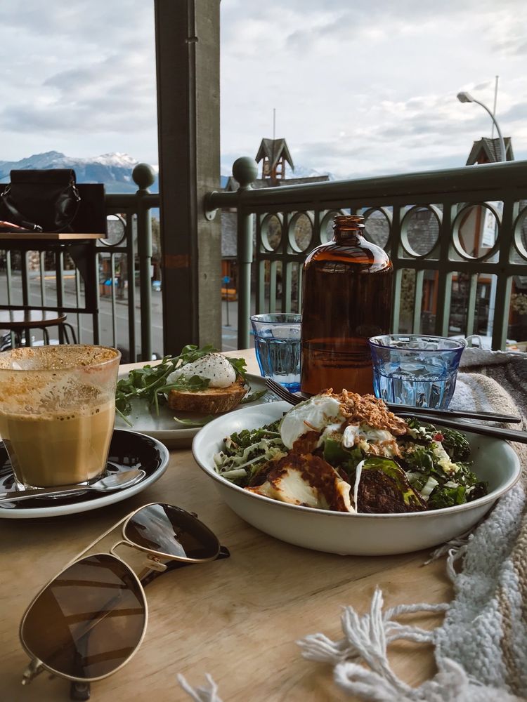 Sunhouse Cafe food on the table with coffee and sunglasses