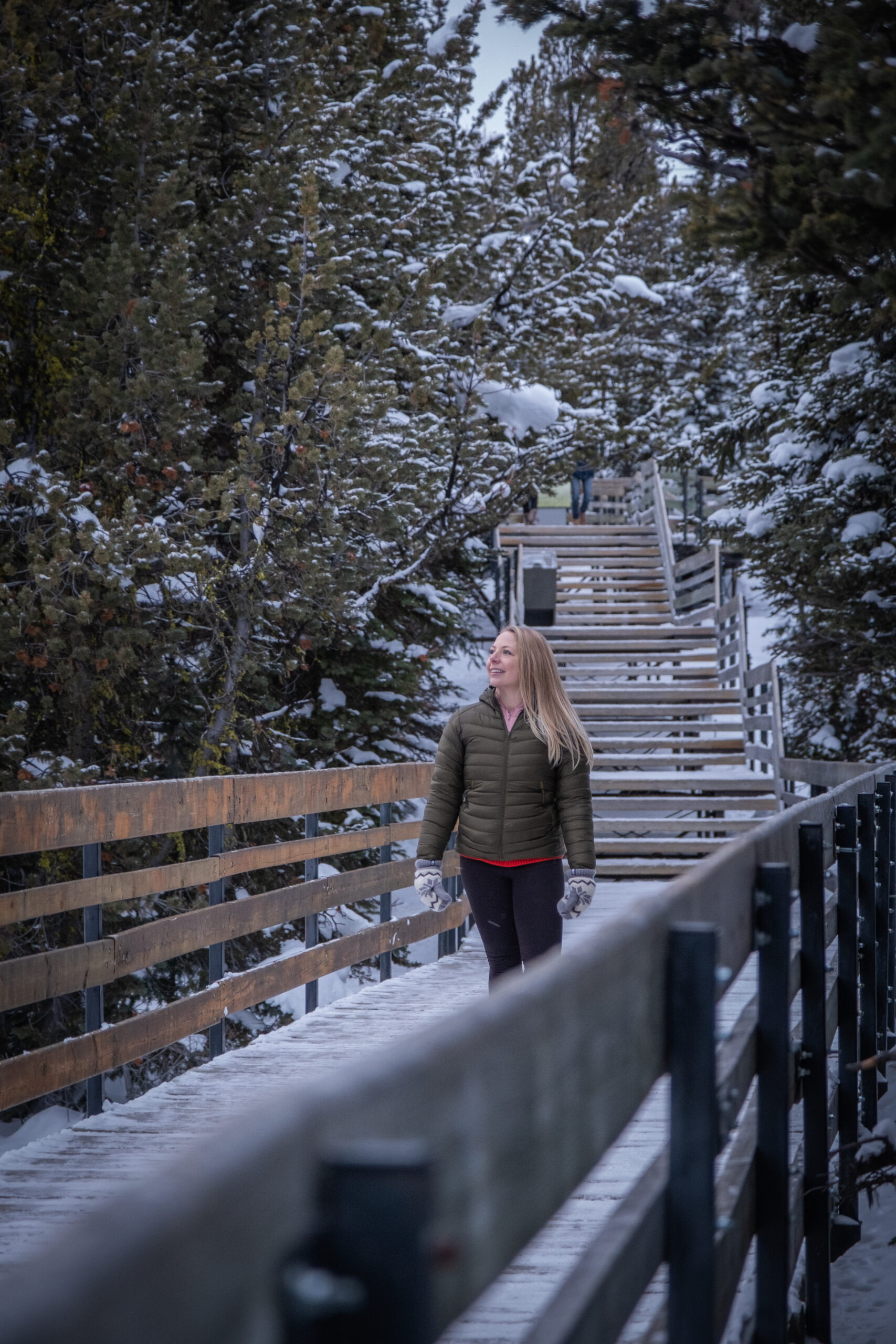 Natasha walks along Banff Gondola boardwalk in the winter with plenty of snow