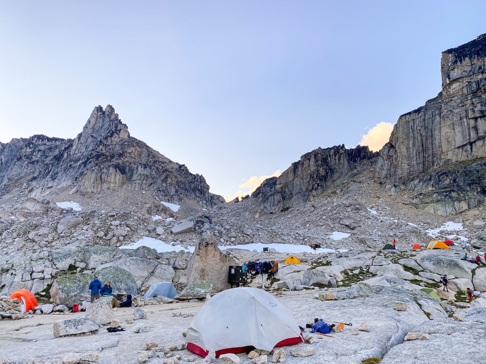 The Appleebee dome campground with many tents and some climbers relaxing