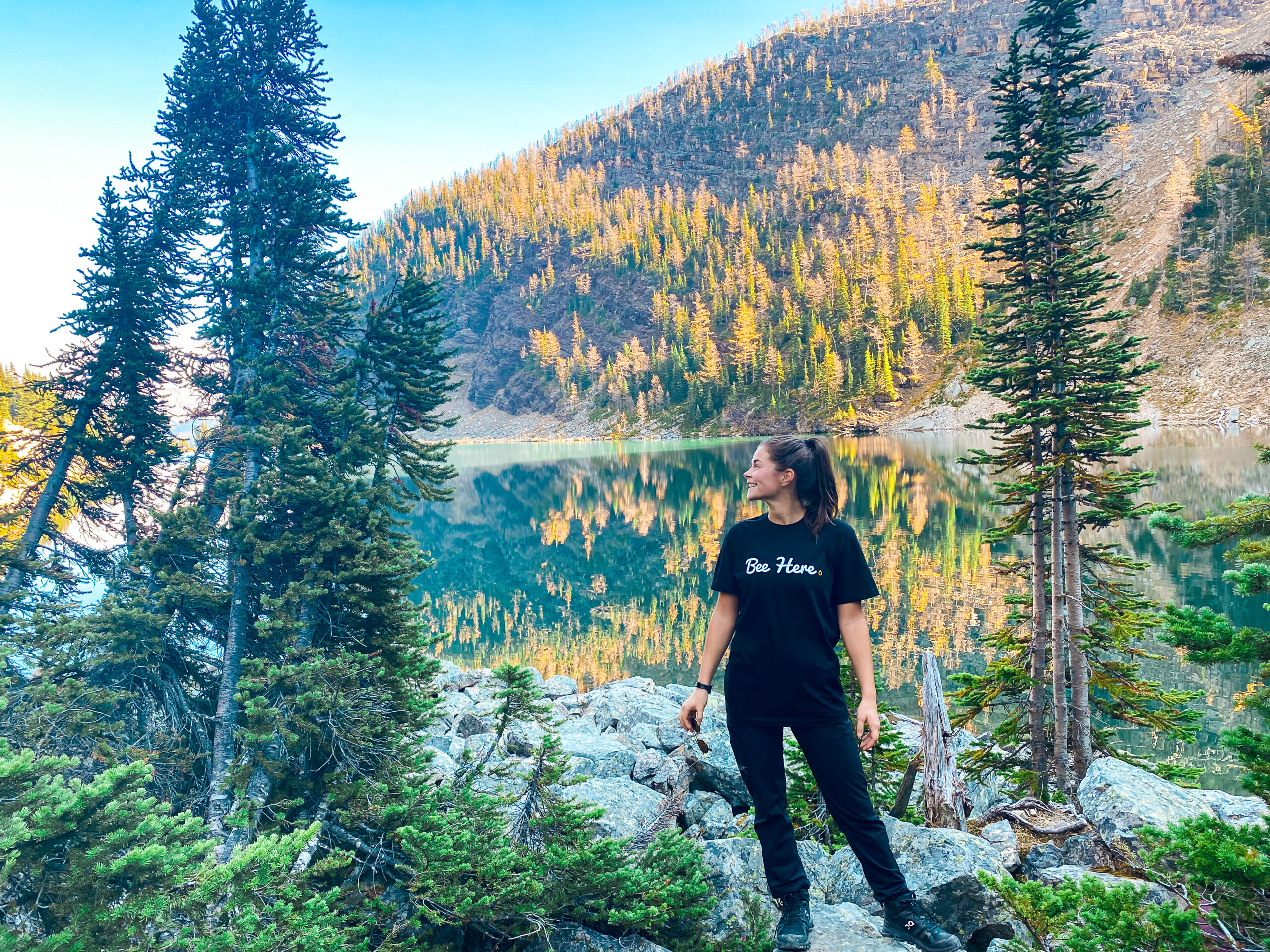 Regan in front of Lake Agnes with larch trees