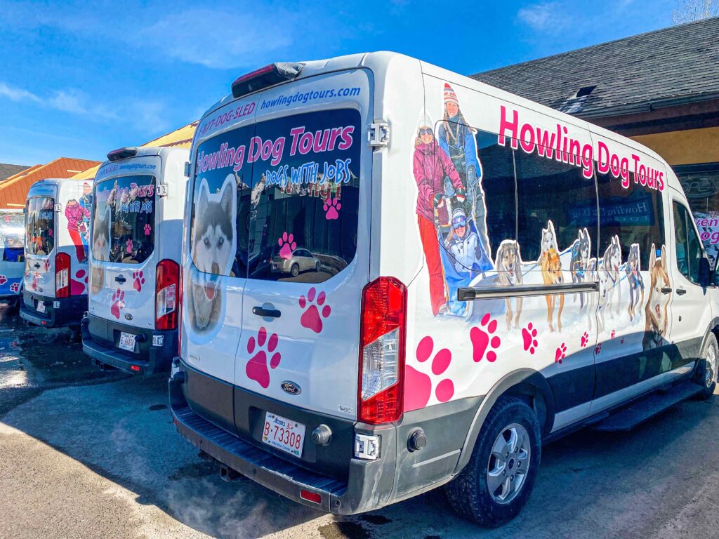 The Howling Dog Tours shuttle vans in their office parking lot
