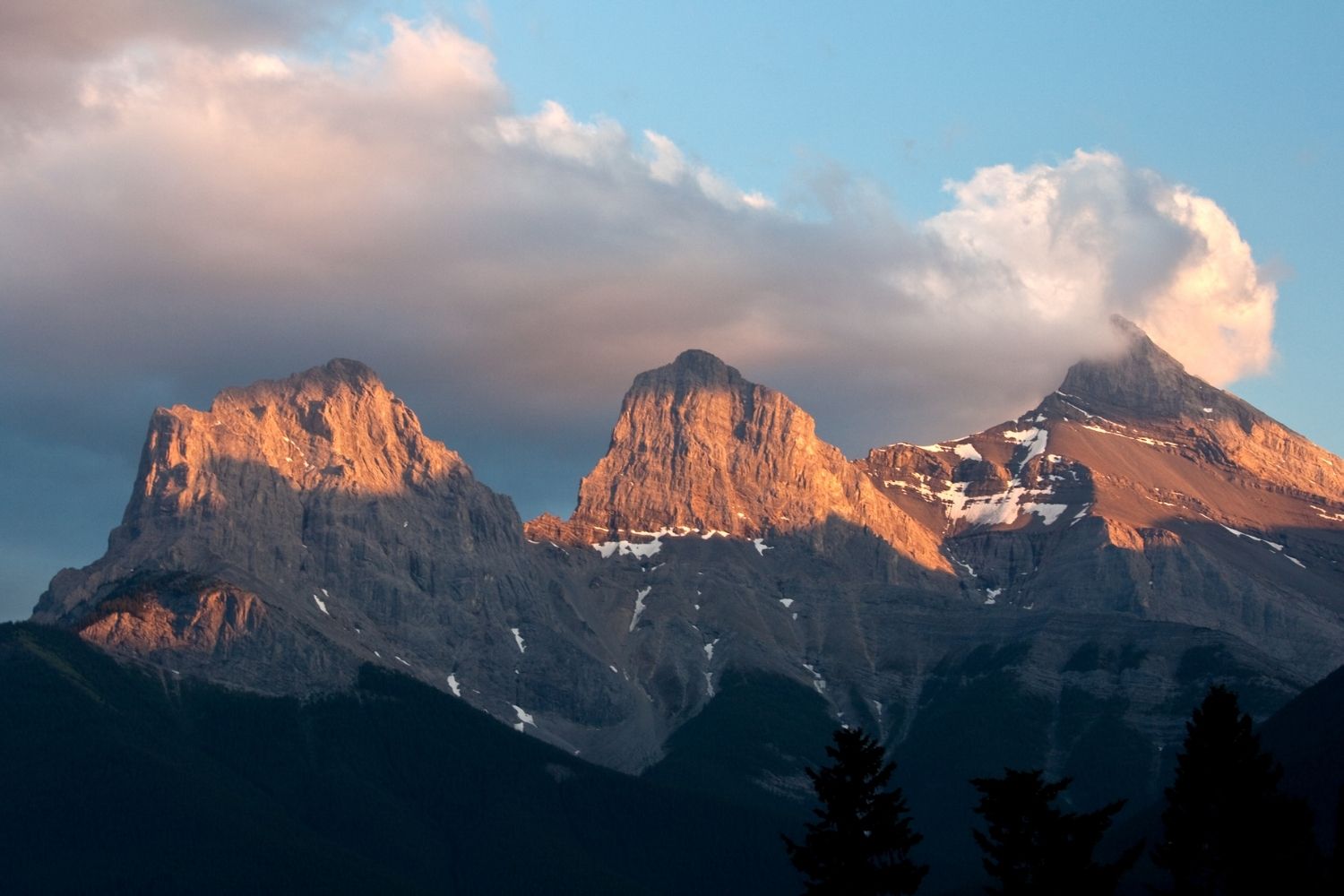 View Of The Three Sisters In Canmore At Sunset