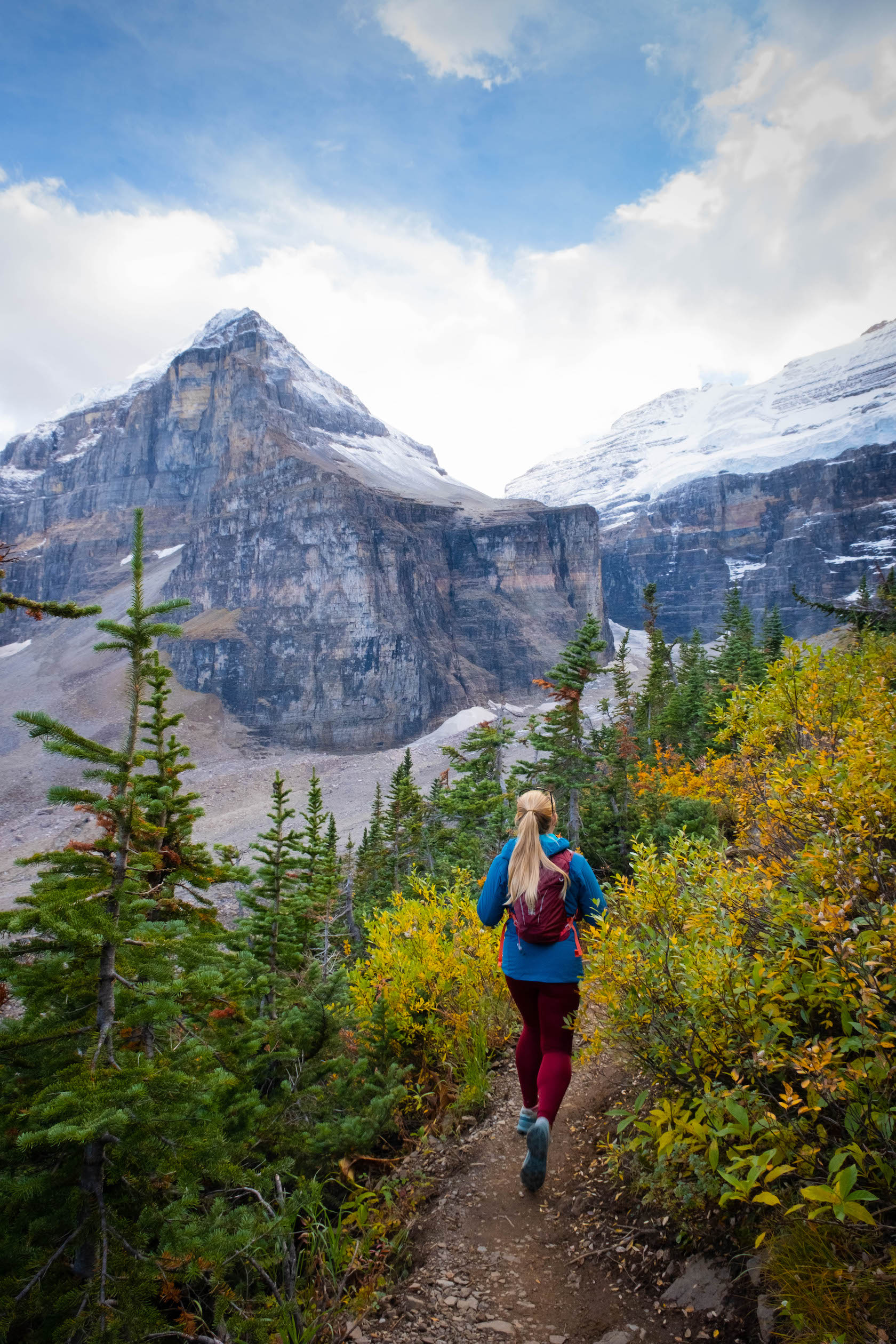 Natasha hiking along Plain of Six Glaciers trail below Mount Lefroy & Victoria