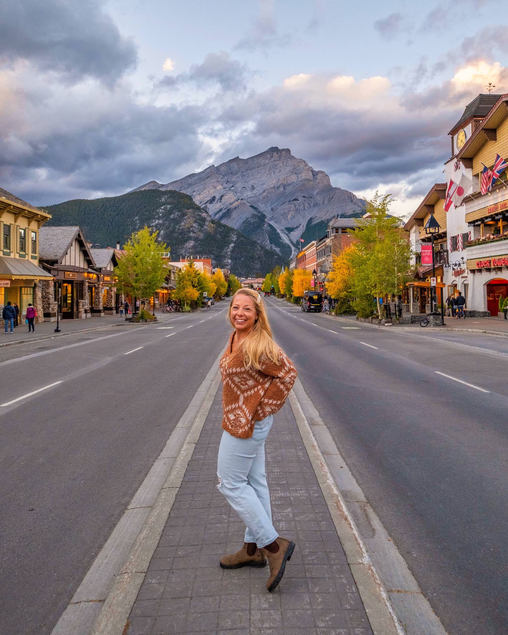 Natasha Stands On Banff Avenue In The Fall