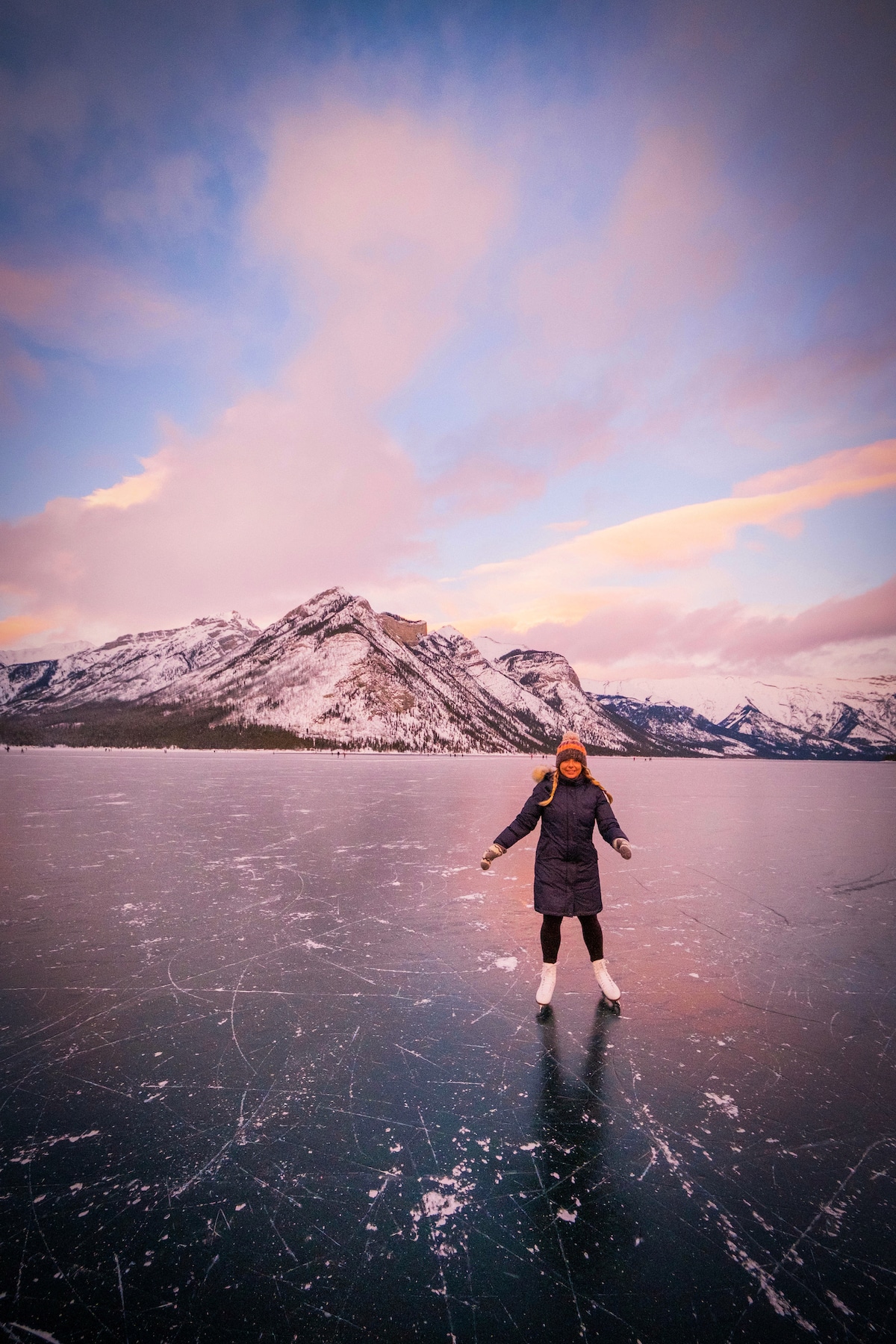 natasha skating on lake minnewanka at sunset