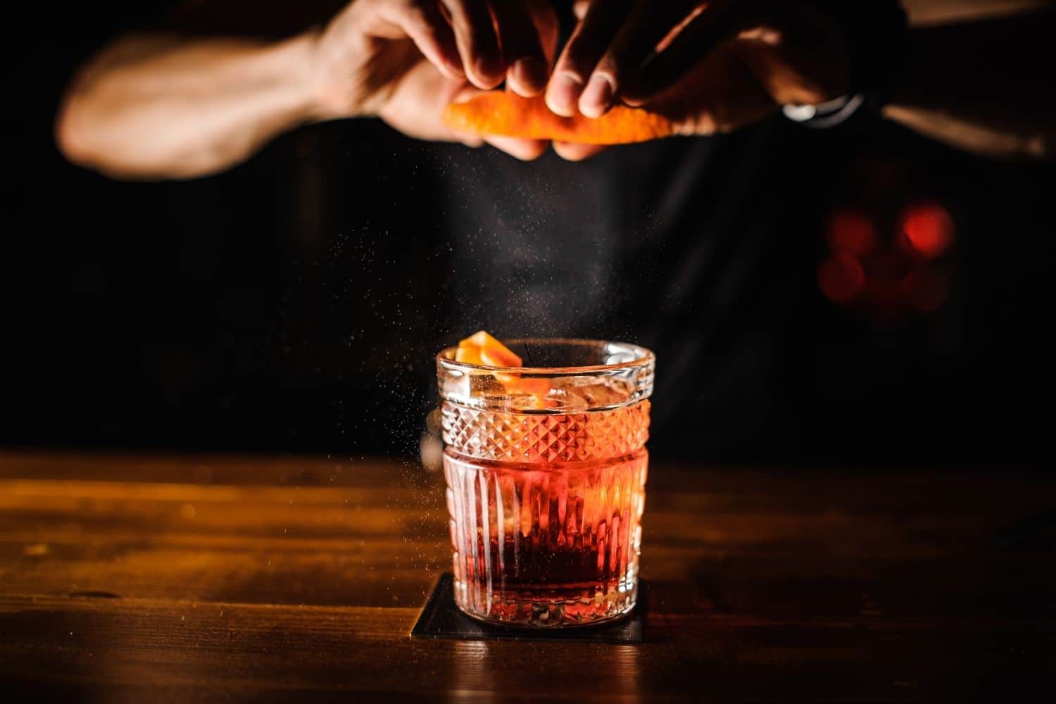 Bartender crafting cocktail in Edmonton