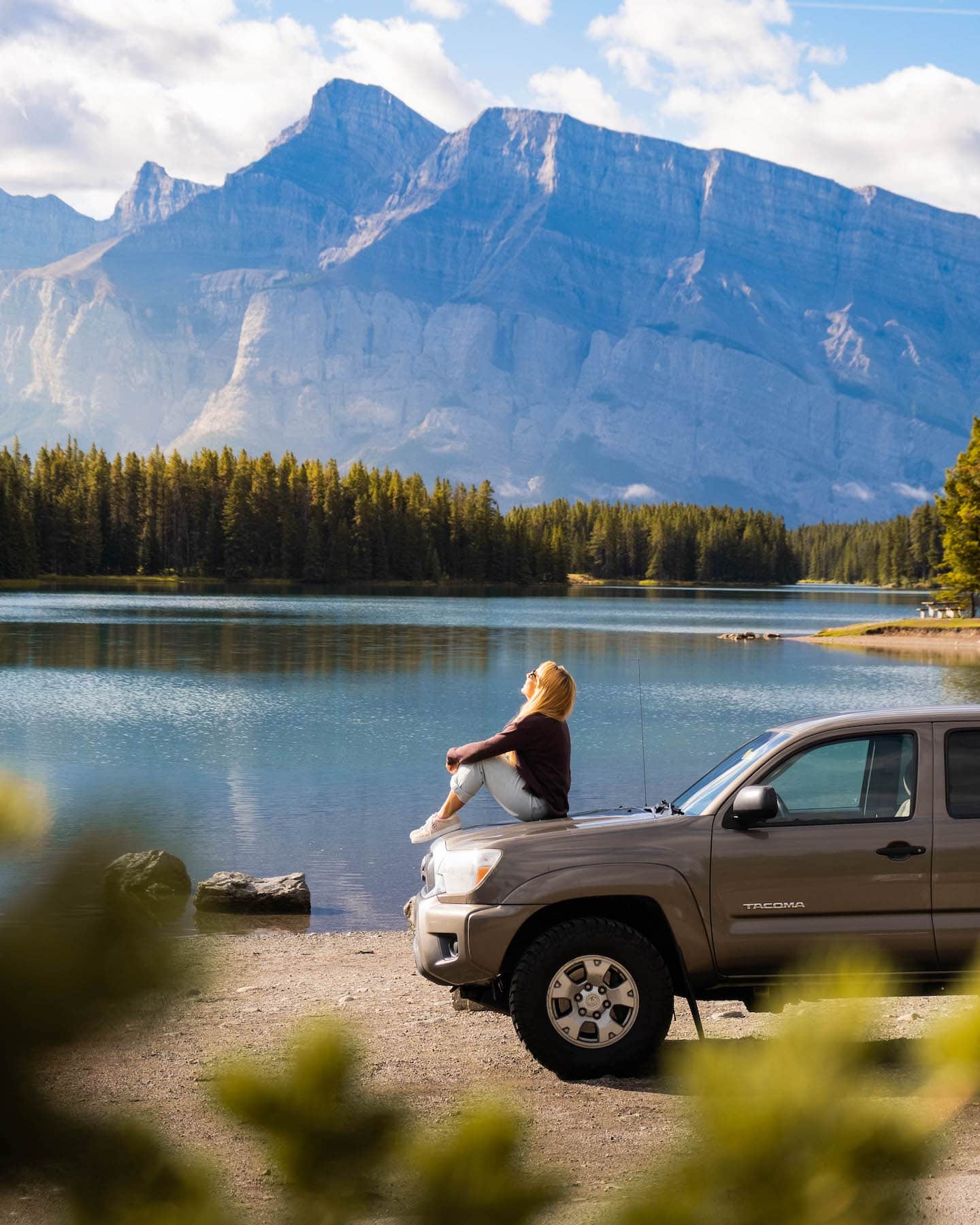 Natasha Sits On Our Truck At Two Jack Lake 