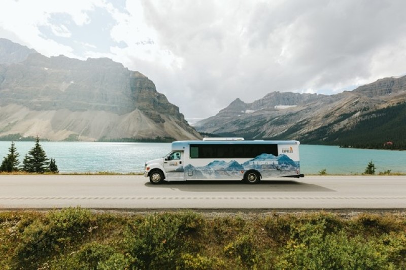 Bus drives along the Icefield Parkway in Banff National Park