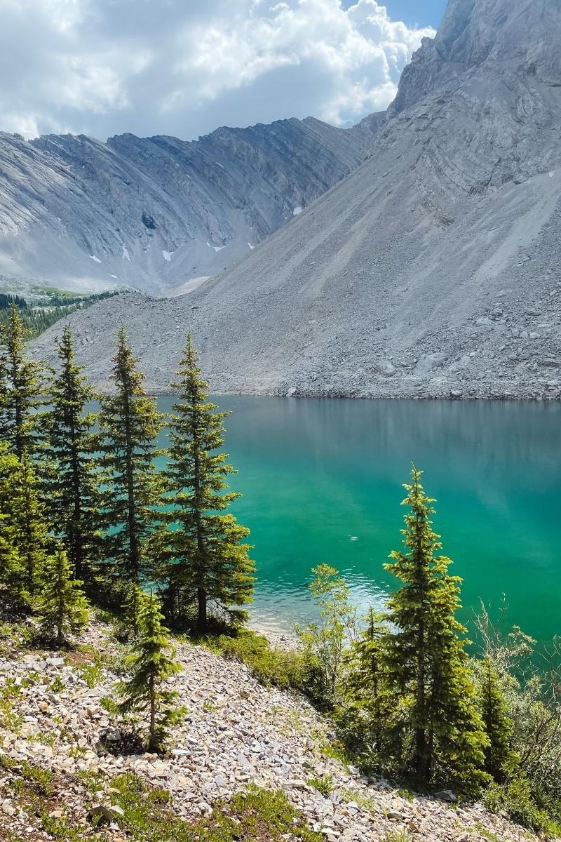 Picklejar Lake with aqua water and jagged peaks in the background