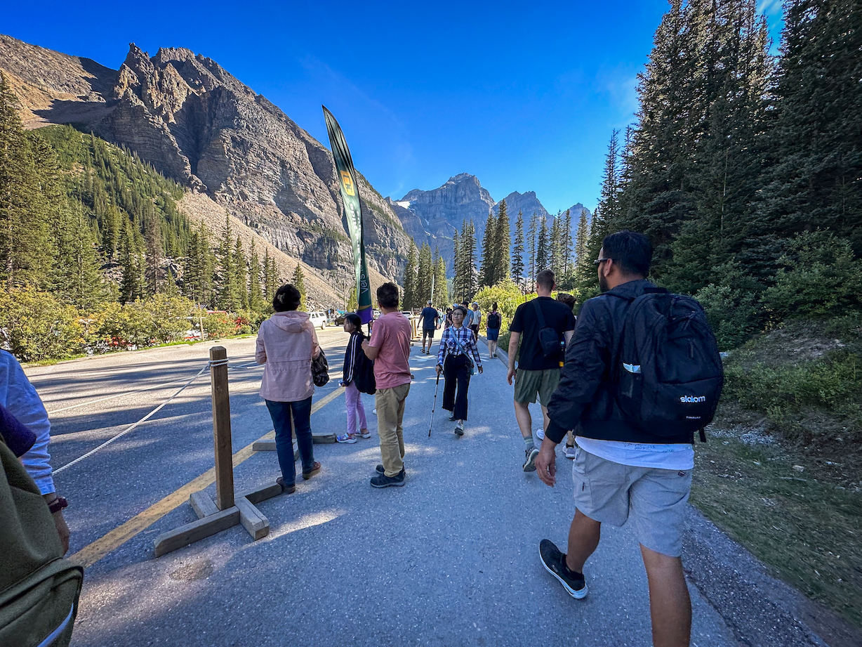 Getting off the shuttle and walking to Moraine Lake, which is a short walk away from the drop off point.